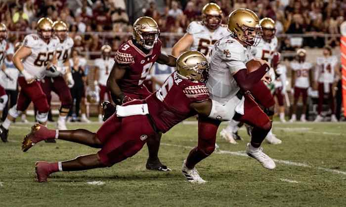 Florida State defensive tackle Dennis Briggs, Jr. (6) tackles Boston College quarterback Phil Jurkovec (5) inside Doak S. Campbell Stadium, Tallahassee, FL. September 24, 2022